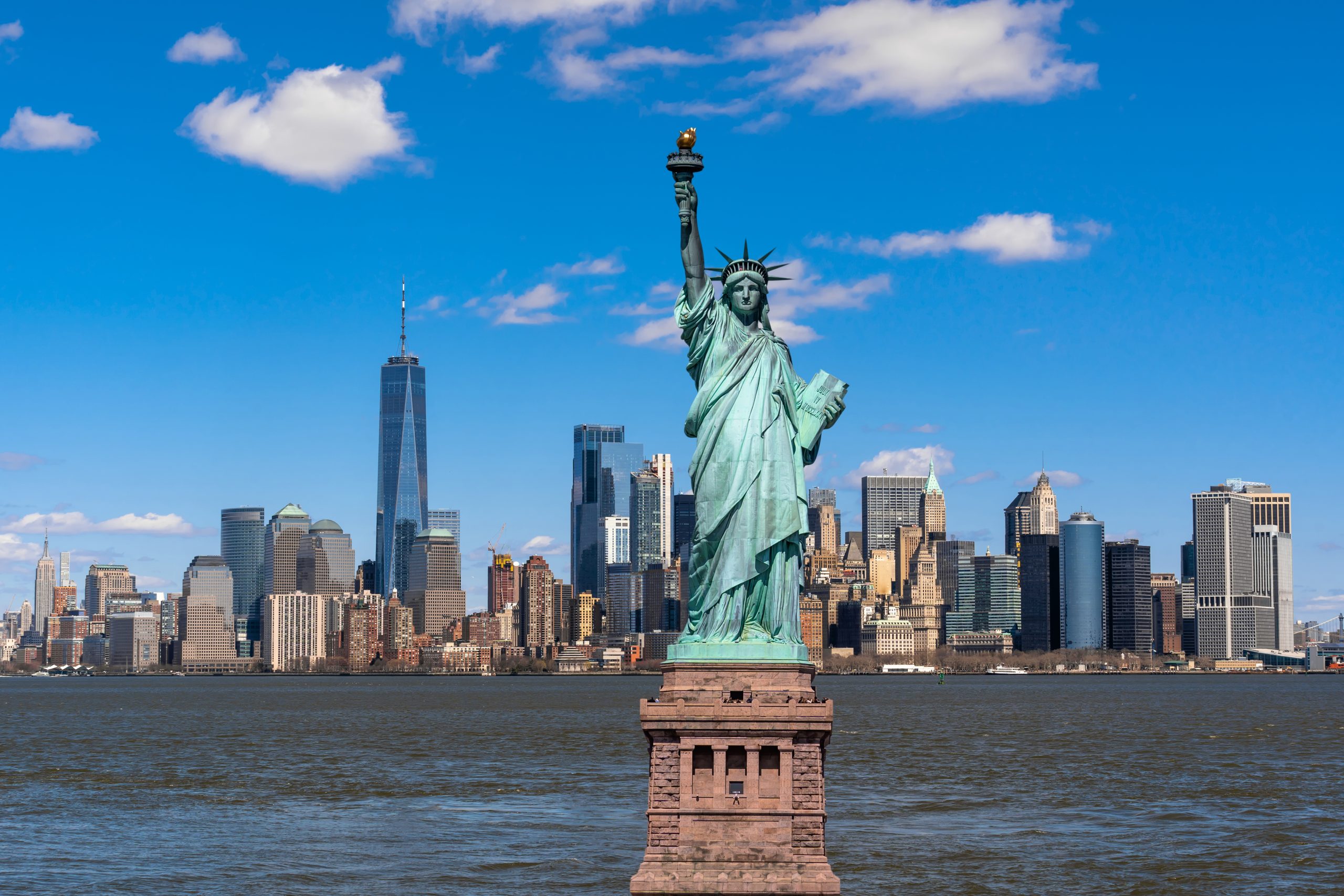 The Statue of Liberty over the Scene of New york cityscape river side which location is lower manhattan,Architecture and building with tourist concept